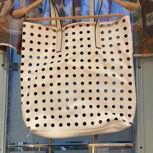 ESTEE LAUDER Stylish cream perforated tote bag.